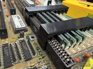 Printed SIMM clips to counter broken slots